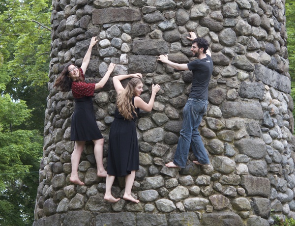 The Free Raisins, climbing on a stone tower.
