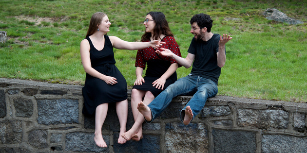 The Free Raisins, sitting on a wall and talking.